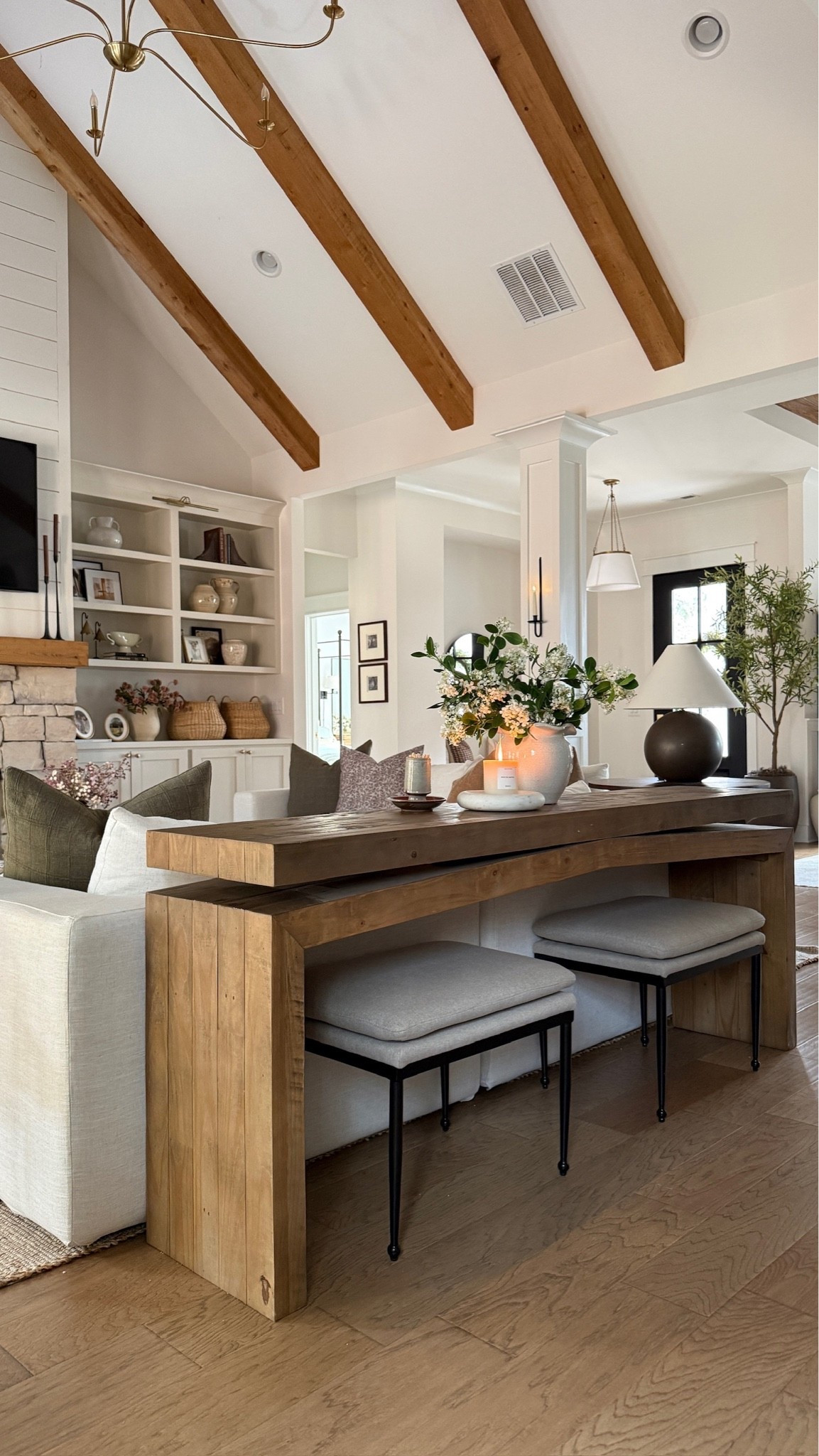 I absolutely love the way this console table works as a sofa table. The ottomans underneath add such a layer of coziest, and I love being able to decorate this table for this seasons. Perfect for our cozy, transitional style living room. 🤍

#LTKHome