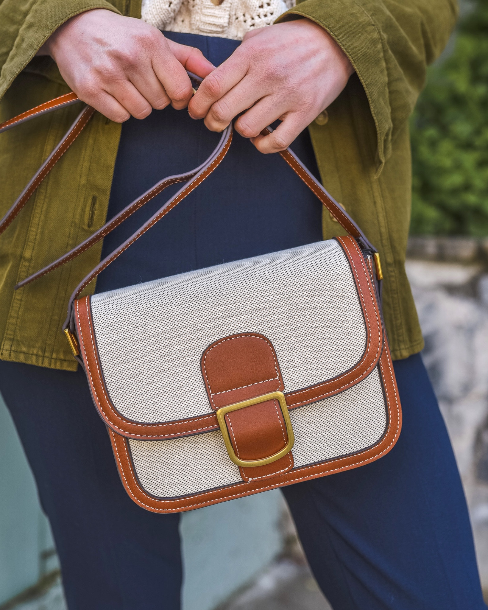 A must have, easy to style canvas bag with faux leather trim.