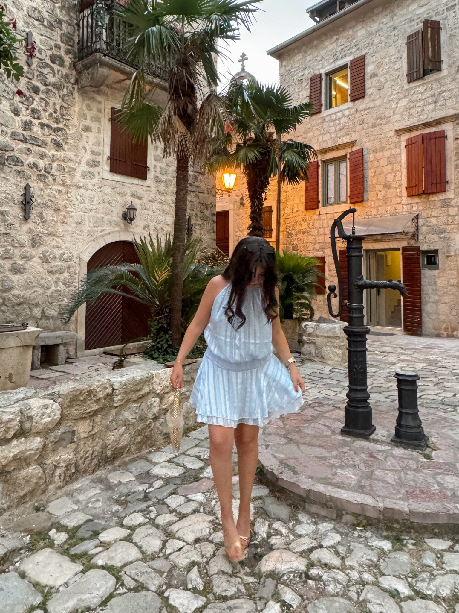 Soft blues, golden accessories, and vacation cobblestone streets 🤍 This breezy mini dress is one of those pieces you’ll reach for all summer—perfect for vacations, bridal events, dinners al fresco, or weekend brunch. Paired it with metallic sandals and a woven clutch for an effortlessly elevated warm-weather look. ☀️✨

#LTKootd #LTKSeasonal #LTKTravel