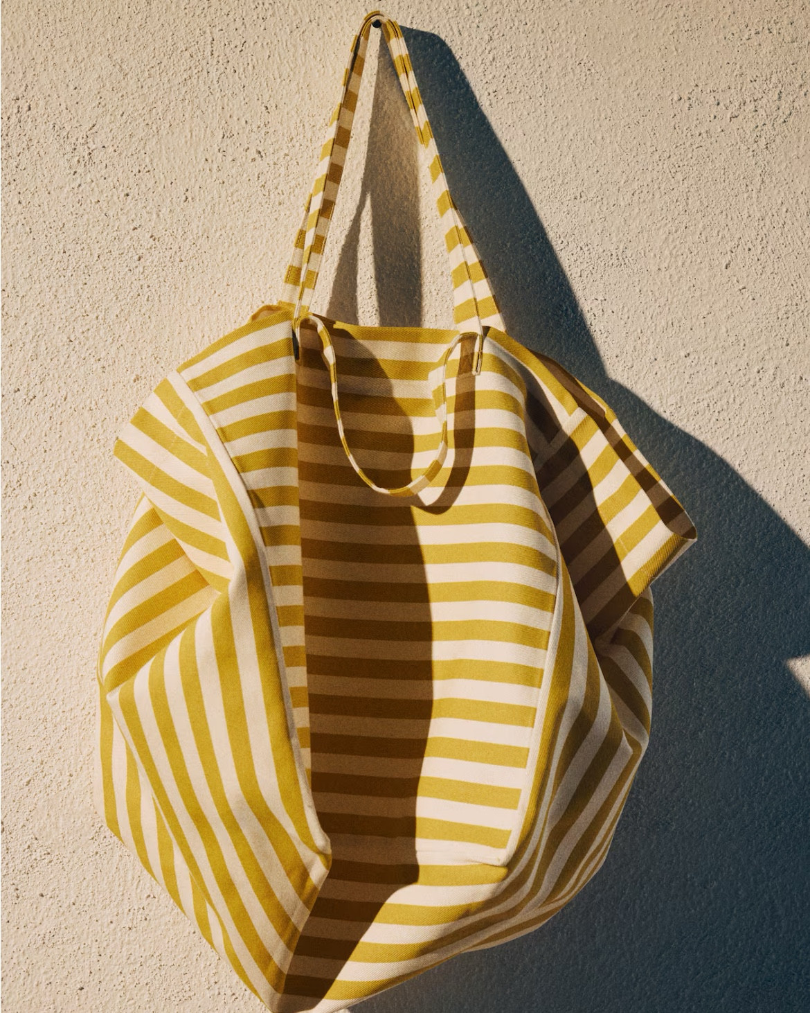 Yellow and white striped canvas tote bag 
Beach bag 

#LTKSeasonal