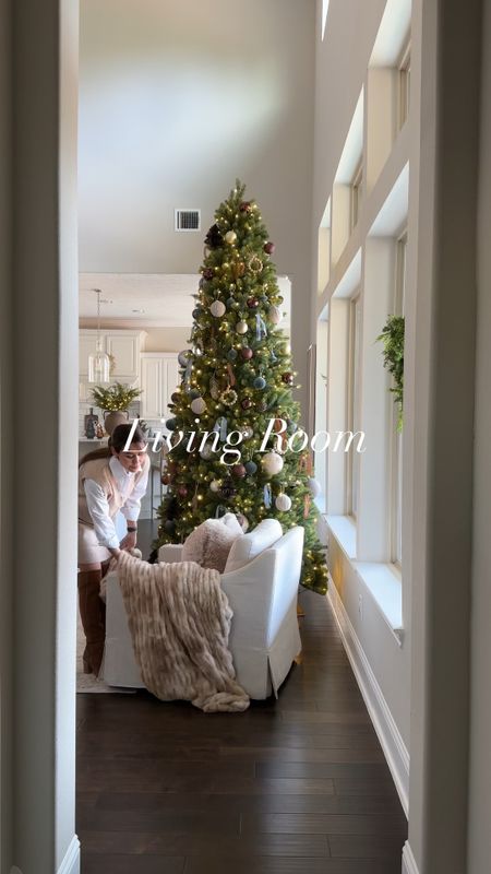 Living Room Christmas tour. From my 10’ Christmas Tree to the beautiful faux fur throw blanket. My sofa is on sale and my arhaus coffee table is a crowd favorite. Check out all my living room home decor here 

#LTKstyletip #LTKHoliday #LTKVideo