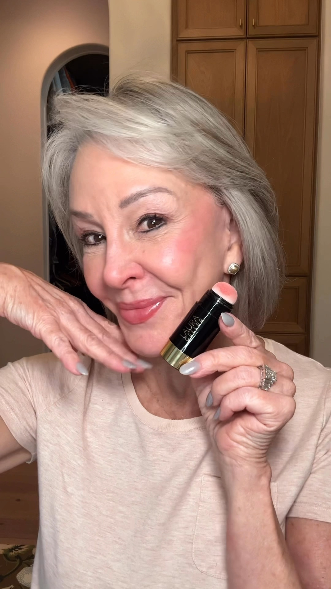 Today we are talking about a trending new makeup product @lauragellerbeauty called Serum Blush Cheek Tint.
There are do many pretty colors and today we are introducing a new color Casual Coral. It’s lightweight, infused 
With hyaluronic acid so it goes on so easily giving giving you that dewy fresh look, and it is cooling to the skin.
I love it because it is buildable, perfect for creating day to nighttime looks. To use apply the serum to your cheeks.
You can blend it in with your fingers, a sponge, or Laura Geller’s beautiful makeup blush brush.
Laura Geller has been helping us girls with mature skin since 2017. Thank you and keep on bringing us those 
great products. 