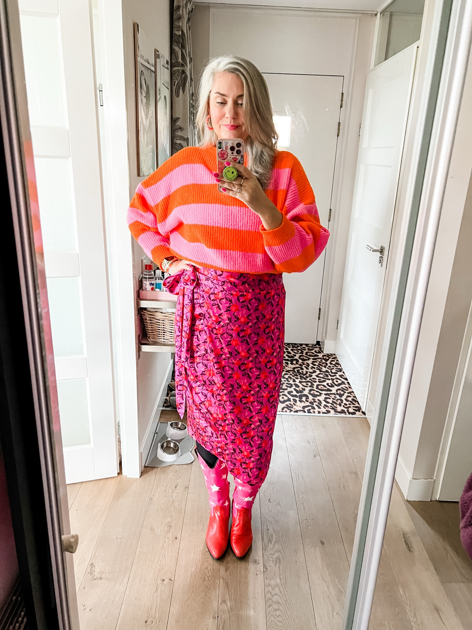 Ootd - Tuesday. Pink and orange striped sweater (old) paired with a purple satin wrap skirt with fruit print (https://wehkamp-nl.mtpc.se/5091073), pink and red western boots (old)



#LTKnederlands #LTKFashionMonth #LTKeurope