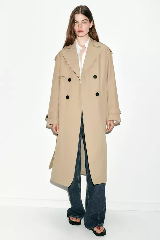 Lapel collar trench coat with long sleeves with tabs and buttons. Front welt pockets. Hem with ba... | Zara Canada
