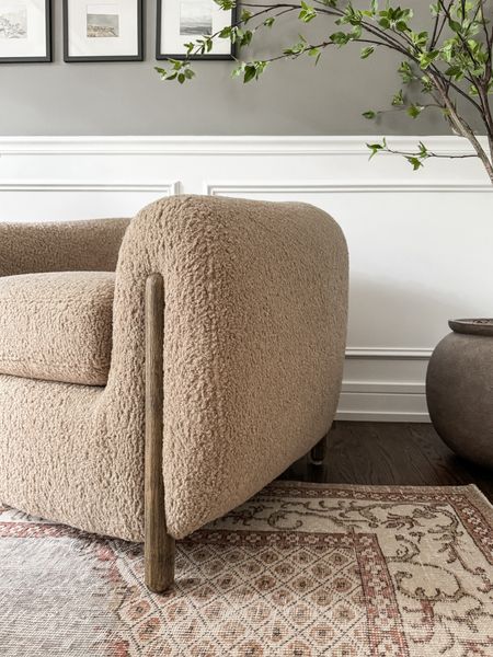 A closer look at our stunning new lounge chairs! The softest and coziest sheepskin fabric and the wooden dowel accent makes these chairs even better! 

#LTKHome #LTKStyleTip