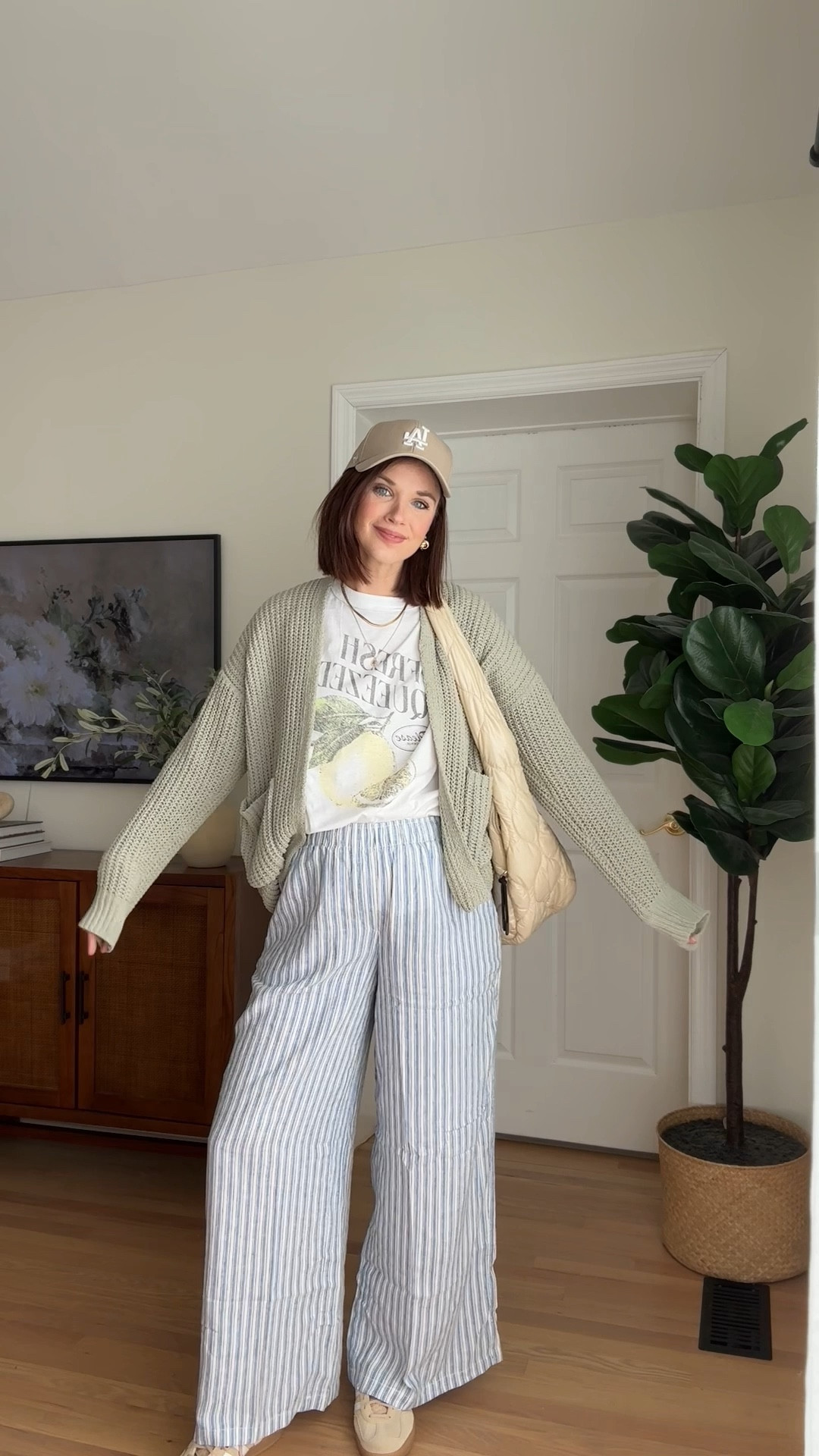 Sweater : wearing small
Graphic tee : wearing small (fits oversized) 
Stripe linen pants : wearing m
Baseball hat
Adidas gazelle
Gold earrings
Gold necklace 

Mom outfit // mom style // pregnancy style // maternity style // pregnancy outfit 

#LTKFindsUnder100 #LTKBump #LTKSeasonal