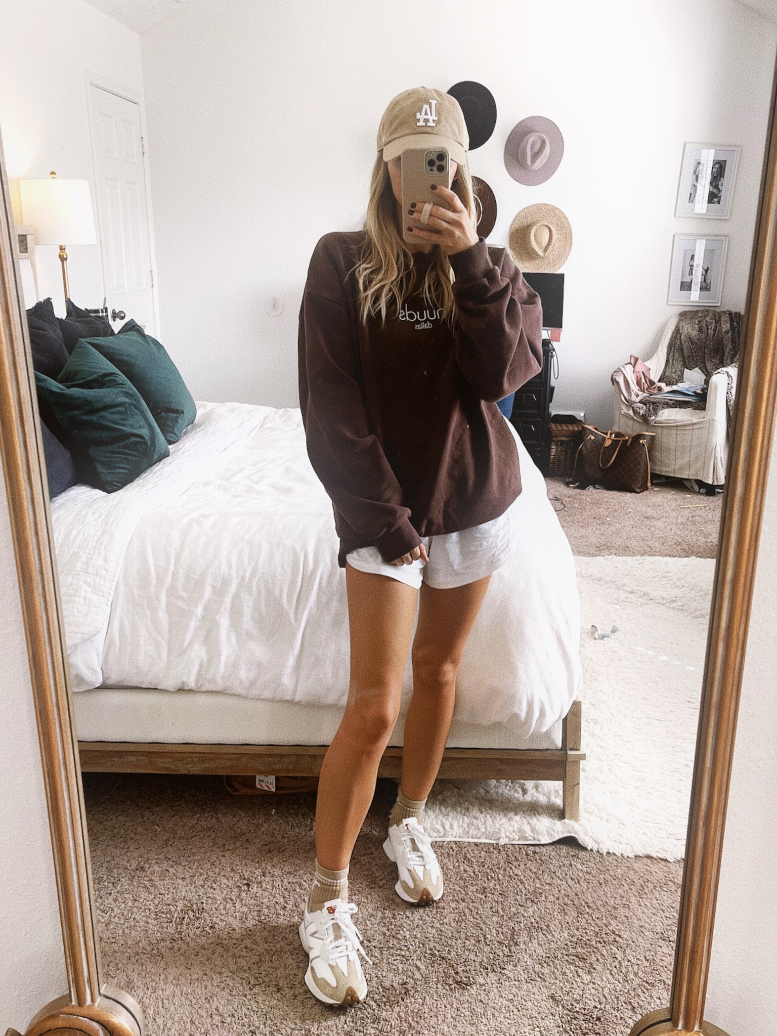 Cozy travel outfit. Size 4 in my lululemon shorts. Size 8 in new balance 327s. Size medium in Nuuds sweatshirt  

#LTKstyletip #LTKfindsunder100 #LTKtravel