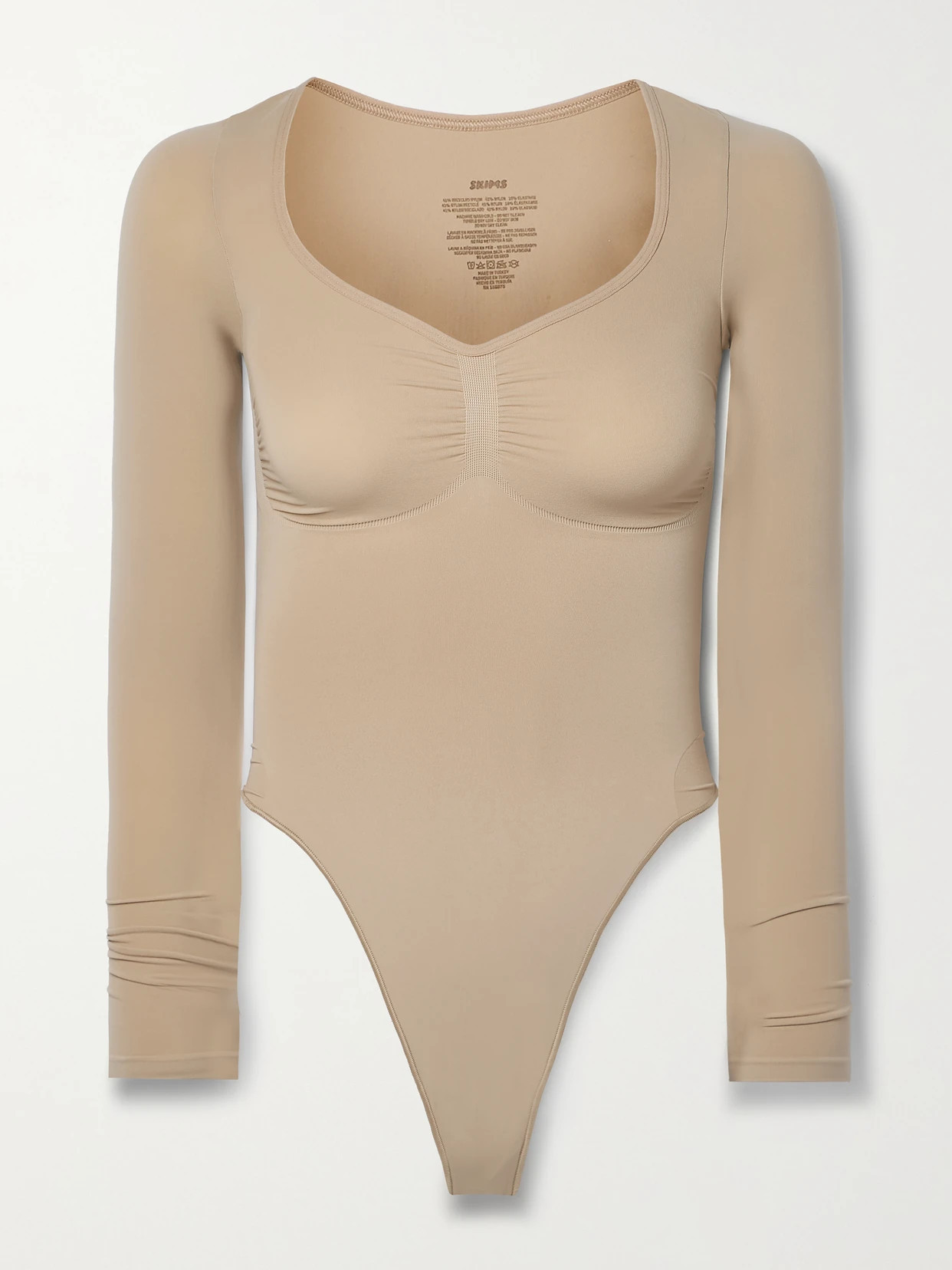 SKIMS - Seamless Sculpt Long Sleeve Thong Bodysuit - Clay | NET-A-PORTER (US)