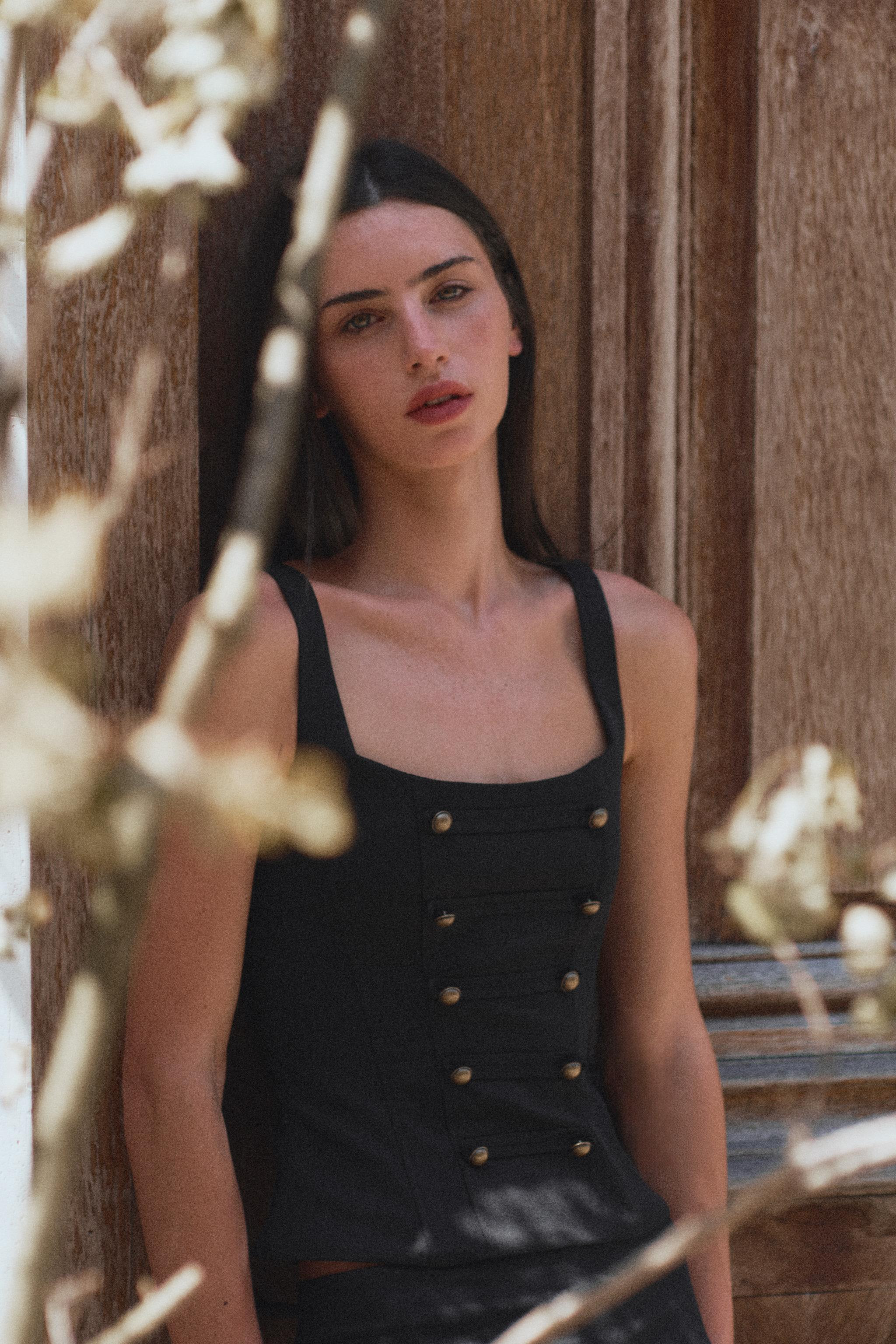 Model height: 178 cmTop with a square neckline and straps. Featuring defined seams and button app... | Zara UK