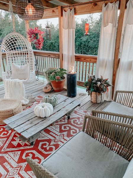 Fall vibes on our back porch 
Target outdoor chairs, egg swing, large outdoor rug under $50 from world market, fire column, Corinthian bells chime from Amazon 
Faux pumpkins West Elm, chunky knit throw blanket, modern farmhouse decor, fall decor 
Glass hummingbird feeder from Walmart 

#LTKSeasonal #LTKhome #LTKunder100