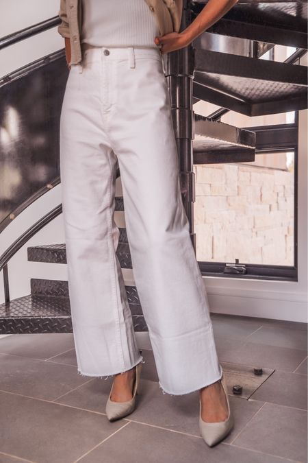 These super chic Pistola white jeans have been Busbee best-sellers for months... and it's no surprise why! 

The wide-leg silhouette combined with the super high 13” rise makes these jeans incredibly flattering. The fit is a little baggier and relaxed, but not too oversized. The fabric has a bit of stretch, but you still feel secure, and the fabric isn’t see-through at all…a VERY important factor in finding the perfect white jeans! There are no front pockets, so you don’t need to worry about pocket linings showing through or extra fabric bulging around the hips. I also love that the smooth front adds to the flattering fit. They have a 27” inseam, which is perfect on me (I’m 5”4’). I can wear these jeans with heels and flats… a big win. In this look, I have on a pair of raffia pumps by Sam Edelman, but I’ve worn these with even higher platforms and flat sandals. Oh, and the best part?? The jeans are under $150!!!

#LTKOver40 #LTKSeasonal #LTKStyleTip