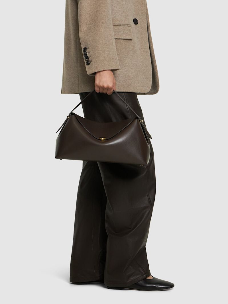 T-Lock leather top handle bag | Luisaviaroma
