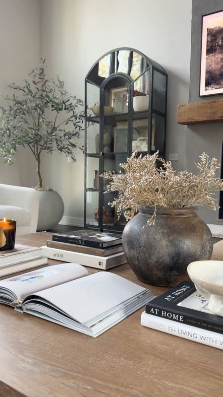 I switched up our coffee table to a neutral organic style, using lots of coffee table books, decorative bowls, dried florals, and a candle  

#LTKstyletip #LTKVideo #LTKfindsunder50