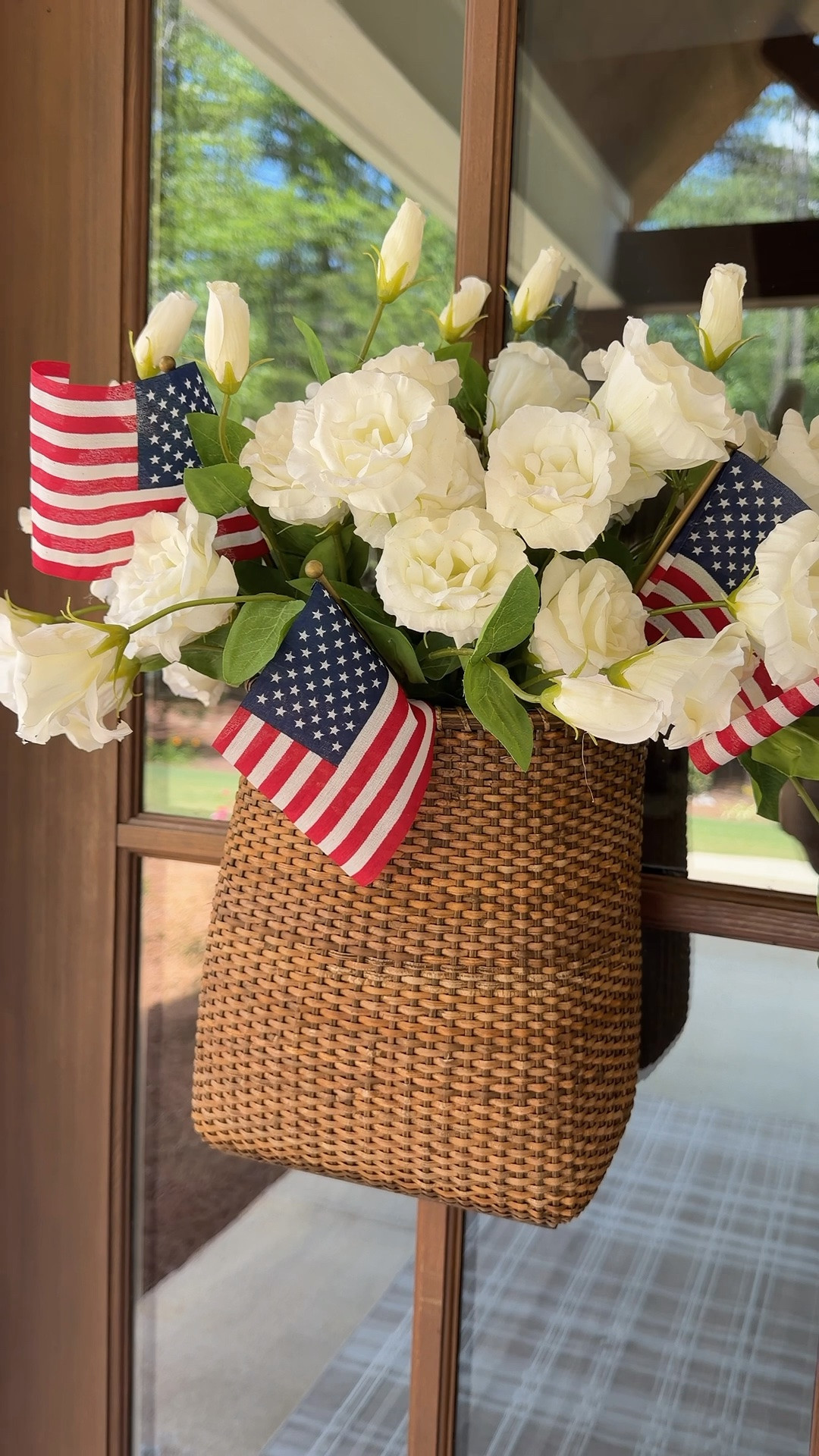 This basket is the perfect size! You can hang it on your door, over your stove. On a hook in your mudroom, etc…. It’s made so well and the color is perfect! I added in some real touch rose stems and 3 flags for a patriotic look. You can remove the flags whenever you are ready!