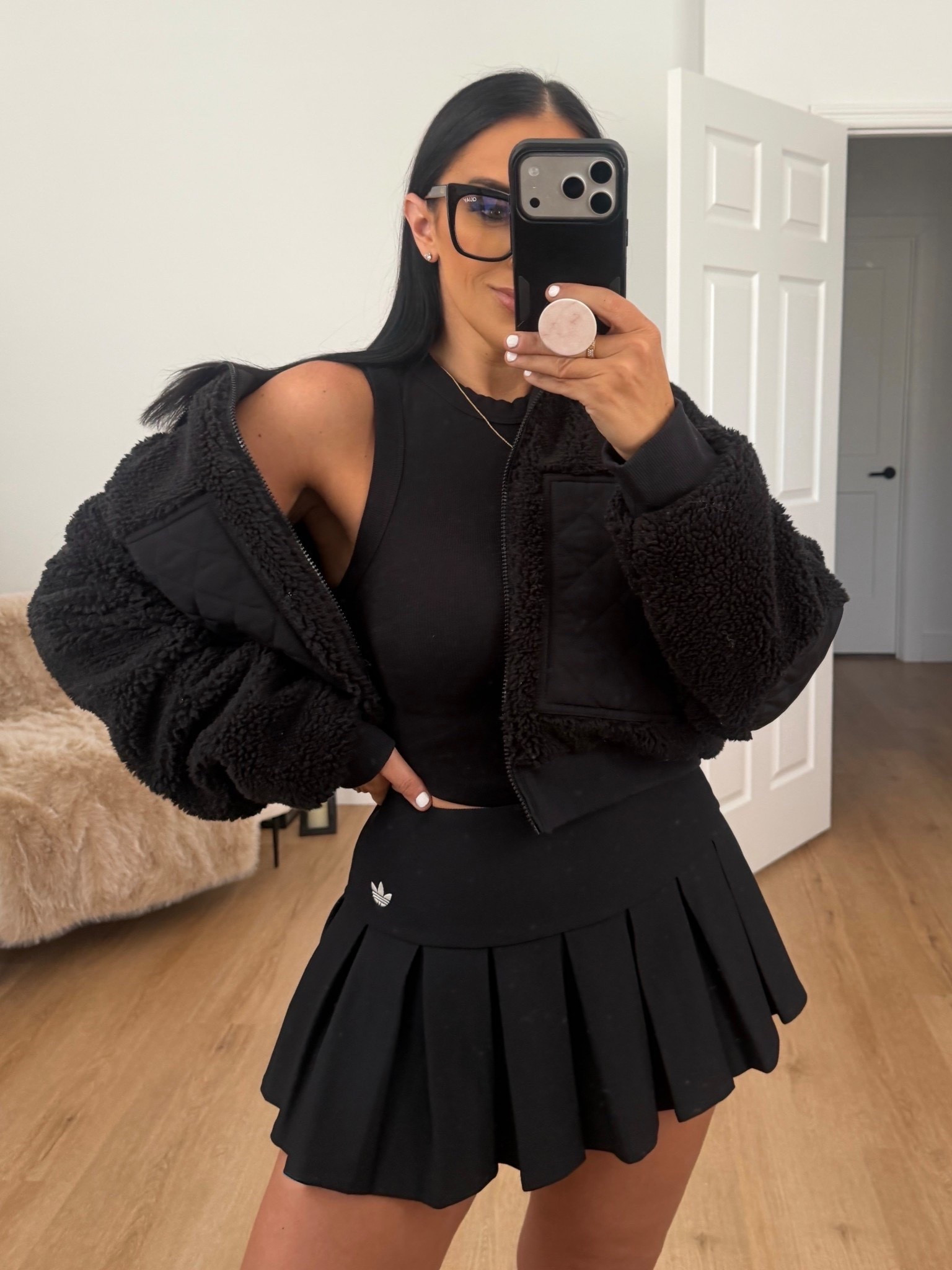 Adidas low waist black sport skirt wearing size 6. Alo Sherpa jacket wearing size medium. Vitamin A essential crop top tank wearing size small