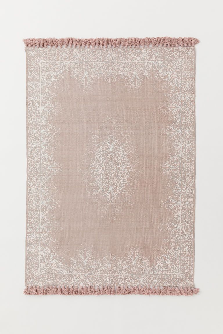 CONSCIOUS. Rectangular rug in woven cotton fabric with a printed pattern at front. Tassels at sho... | H&M (US)