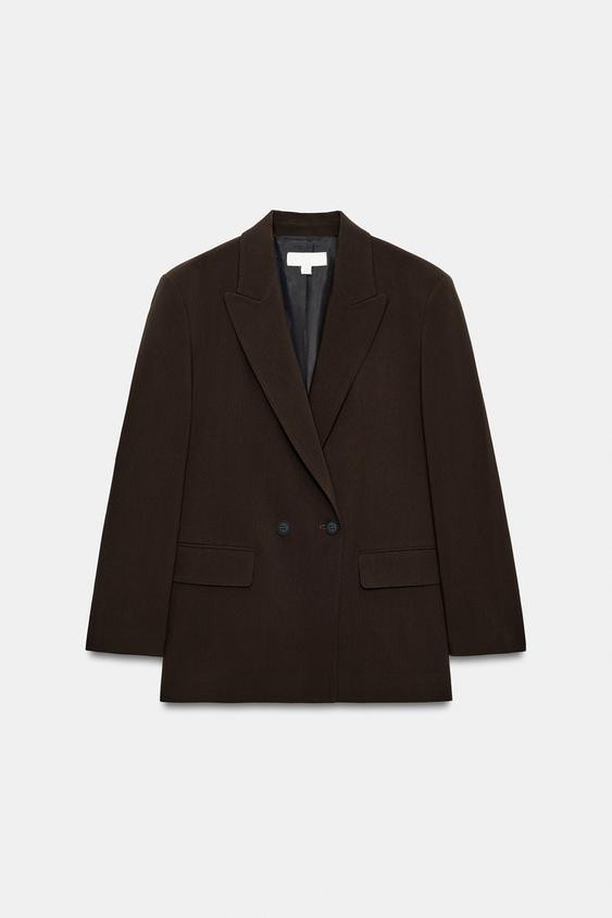 Oversized blazer featuring a lapel collar, long sleeves with shoulder pads, front flap pockets, a... | Zara US