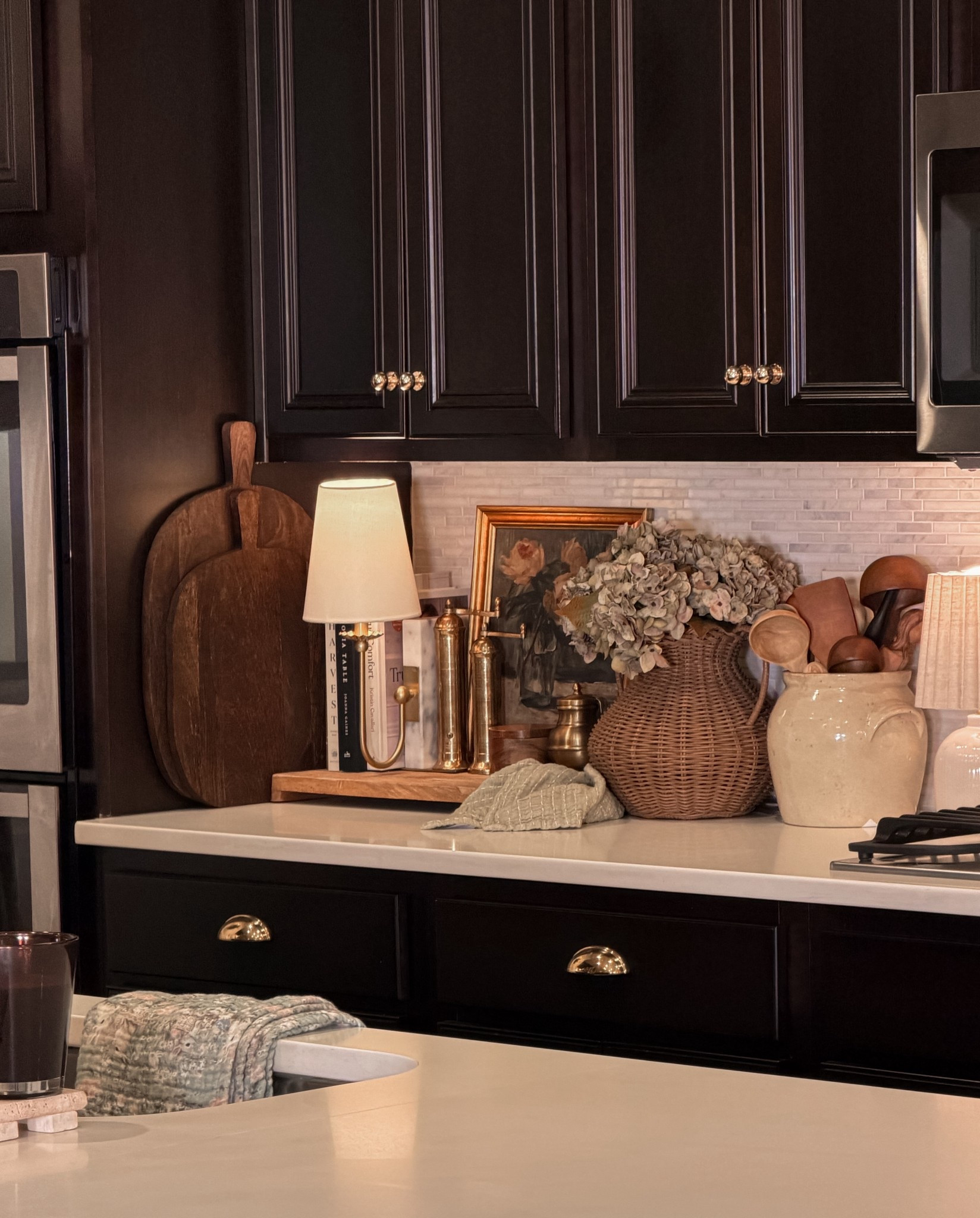 Turning ordinary corners into little pockets of cozy. 🤍Kitchen styling my cozy corner with my favorite vintage finds — brass salt & pepper mills, a wood salt cellar, ghee pot, cutting board, soft kitchen towel, little artwork, a wicker vase, and dried hydrangeas. It’s the little details that make a house feel like home. ✨

#LTKHome