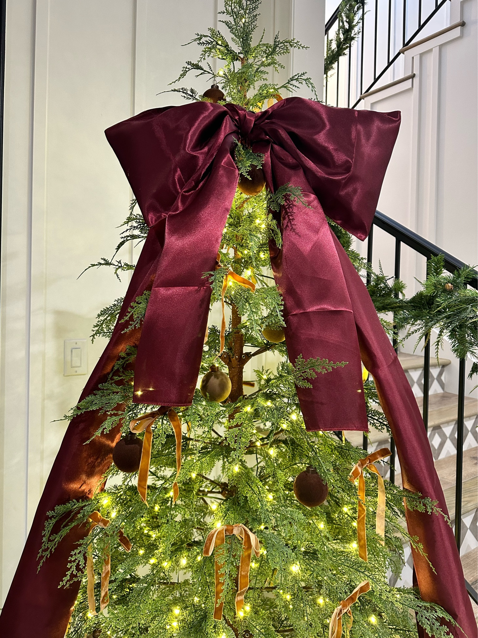 Easy DIY giant holiday bow  

#LTKHome #LTKHoliday #LTKSeasonal