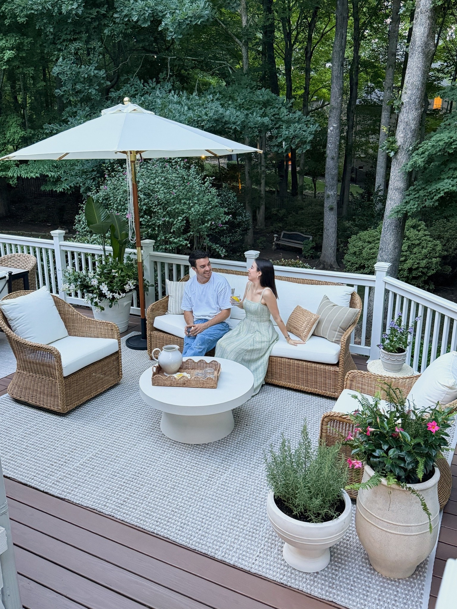 Our new deck!! Love these beautiful wicker outdoor set and this umbrella is absolutely stunning