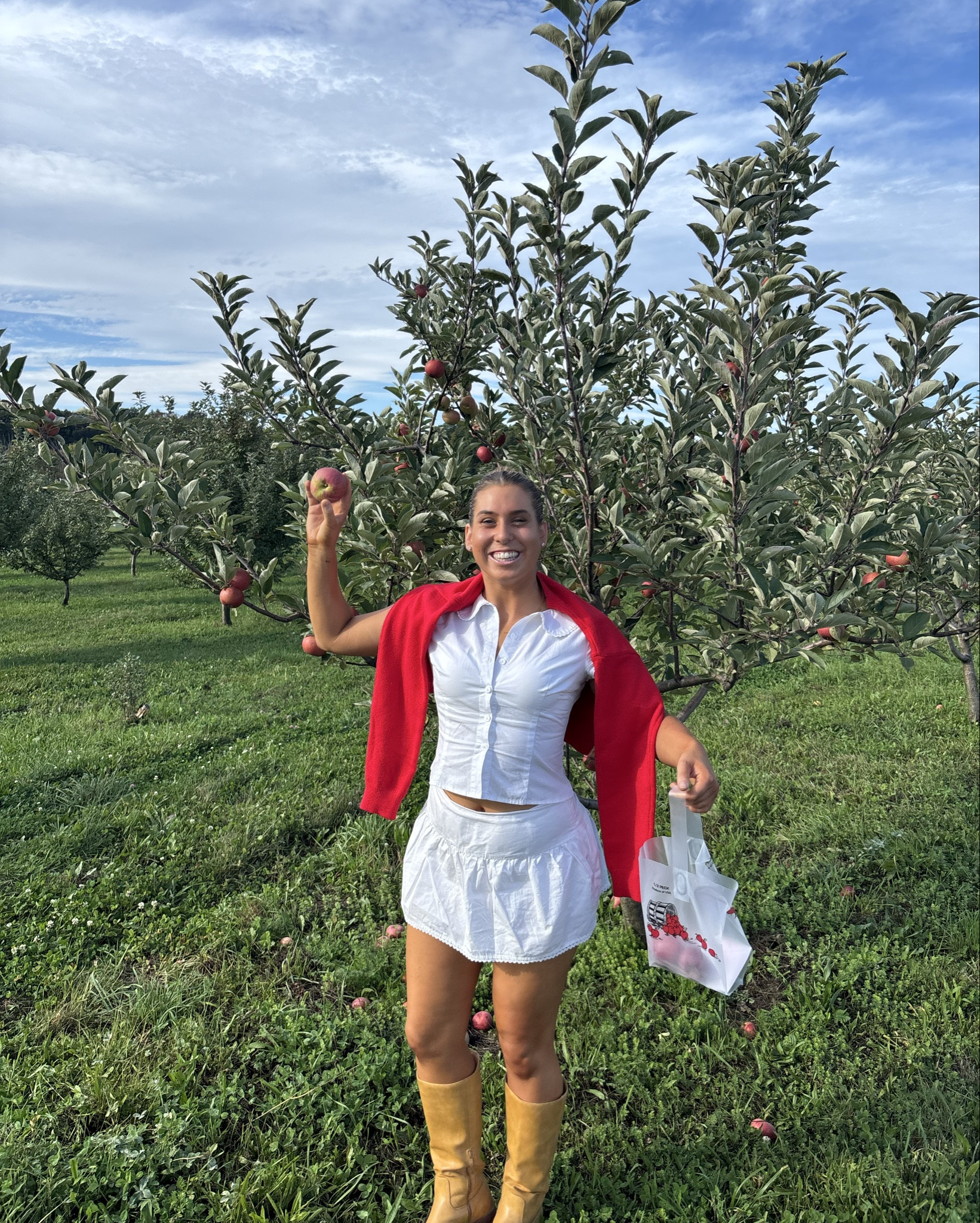 Apple picking fall outfit with brown knee high boots, white skirt set, and red cardigan. Fall inspired perfect for warm weather. 

#LTKHalloween #LTKSeasonal #LTKFindsUnder100