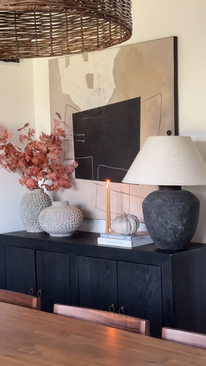 Fall console table styling 🍂

This console table has a few key pieces that stick through the seasonal decor changes: the table lamp + two concrete vases. The things I like the change out are the stem foliage and decorative trinkets on top to fit in with the season. 

You can SHOP these decor pieces on my LTK page (🔗 in profile). 

〰️

#homestyling #falldecor #ltkhome #neutraldecor #homefinds #diningroomdecor #consoletabledecor #interiorstyling #modernfarmhouse #stylewithme

cozy home interiors, shop my home, neutral interiors, fall decorating, dining room decor, european farmhouse, character home, collected interiors