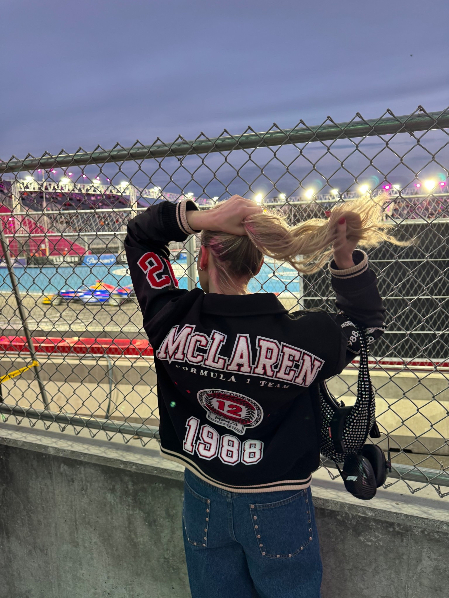 F1, formula one racing, McLaren racing bomber jacket, rhinestone handbag, studded jeans

#LTKTravel #LTKootd #LTKOver40