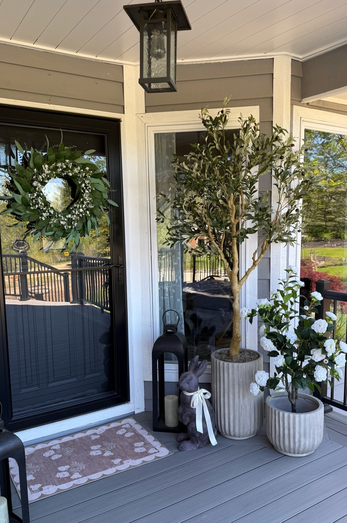 Amazon UV Resistant 6’ Olive Tree.
Follow @farmtotablecreations on Instagram for more cozy neutral home finds and outdoor inspiration 🤍

This little porch refresh instantly made the space feel so much warmer and inviting. The UV resistant olive tree paired with the neutral planters, lanterns, and floral accents gives that high-end designer look without the maintenance of a real tree. Perfect for creating a cozy welcoming entry all season long ✨

The olive tree is built with premium UV-resistant materials designed to stand up to strong, direct sunlight, making it such a beautiful low-maintenance option for covered porches, patios, and outdoor spaces. I love how realistic the leaves and branches look in person 🌿

#amazonhome #porchdecor #olivetree #outdoordecor #frontporch

amazon porch decor | uv resistant olive tree | neutral porch styling | outdoor planters | spring porch refresh | front porch inspiration | amazon outdoor finds | porch lanterns | neutral home decor | cottage porch | outdoor entryway ideas | olive tree decor | outdoor styling | modern farmhouse porch | amazon decor finds | neutral outdoor decor | porch refresh ideas | decorative lanterns | entryway styling | amazon patio decor | cozy porch ideas | outdoor home decor | spring decor ideas | porch planters | front door decor

#LTKHome #LTKSaleAlert #LTKSeasonal