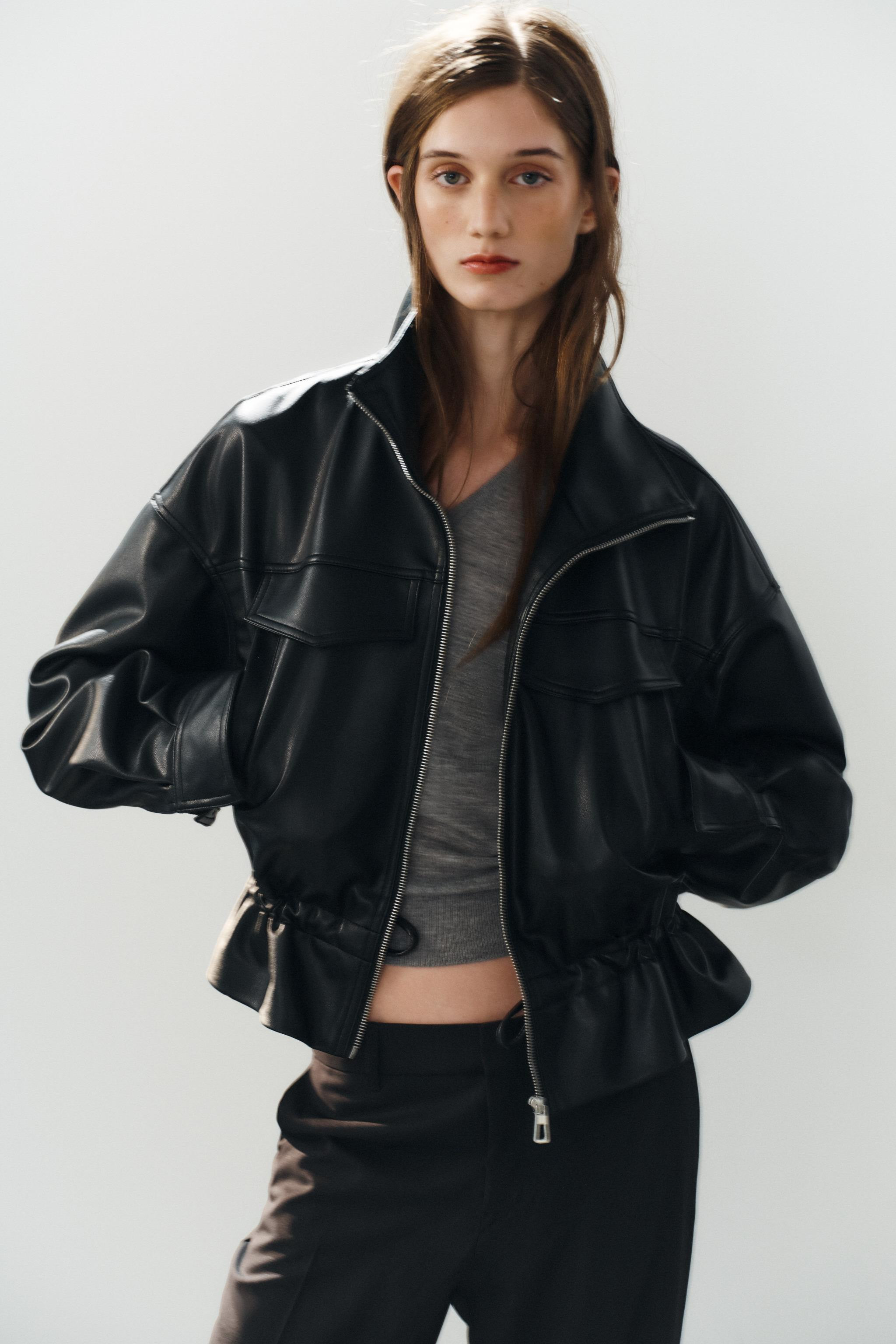 High-neck jacket with long, dropped-shoulder sleeves. Features an adjustable drawstring waist, fr... | Zara US