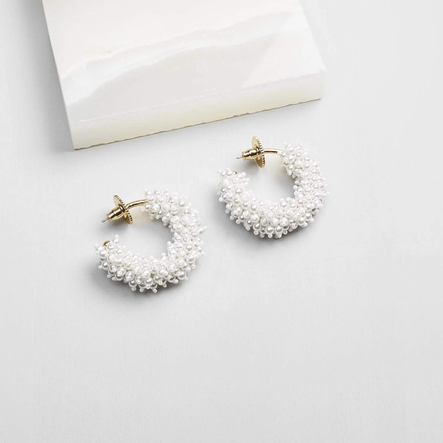 Taylor Mini Hoop Earrings White/Gold by Mignonne Gavigan | Support HerStory