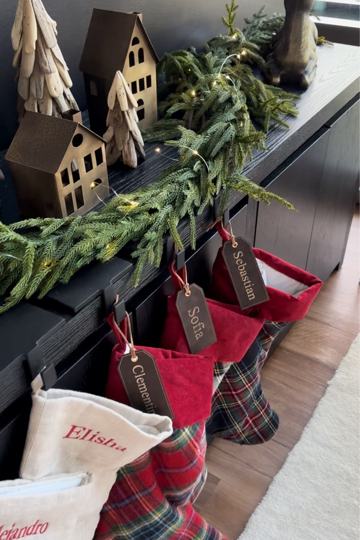 Console styling♥️🎄

Christmas decor, cabinet, garland, stockings, stocking holders, village, house, driftwood trees

#LTKHoliday #LTKHome #LTKSeasonal