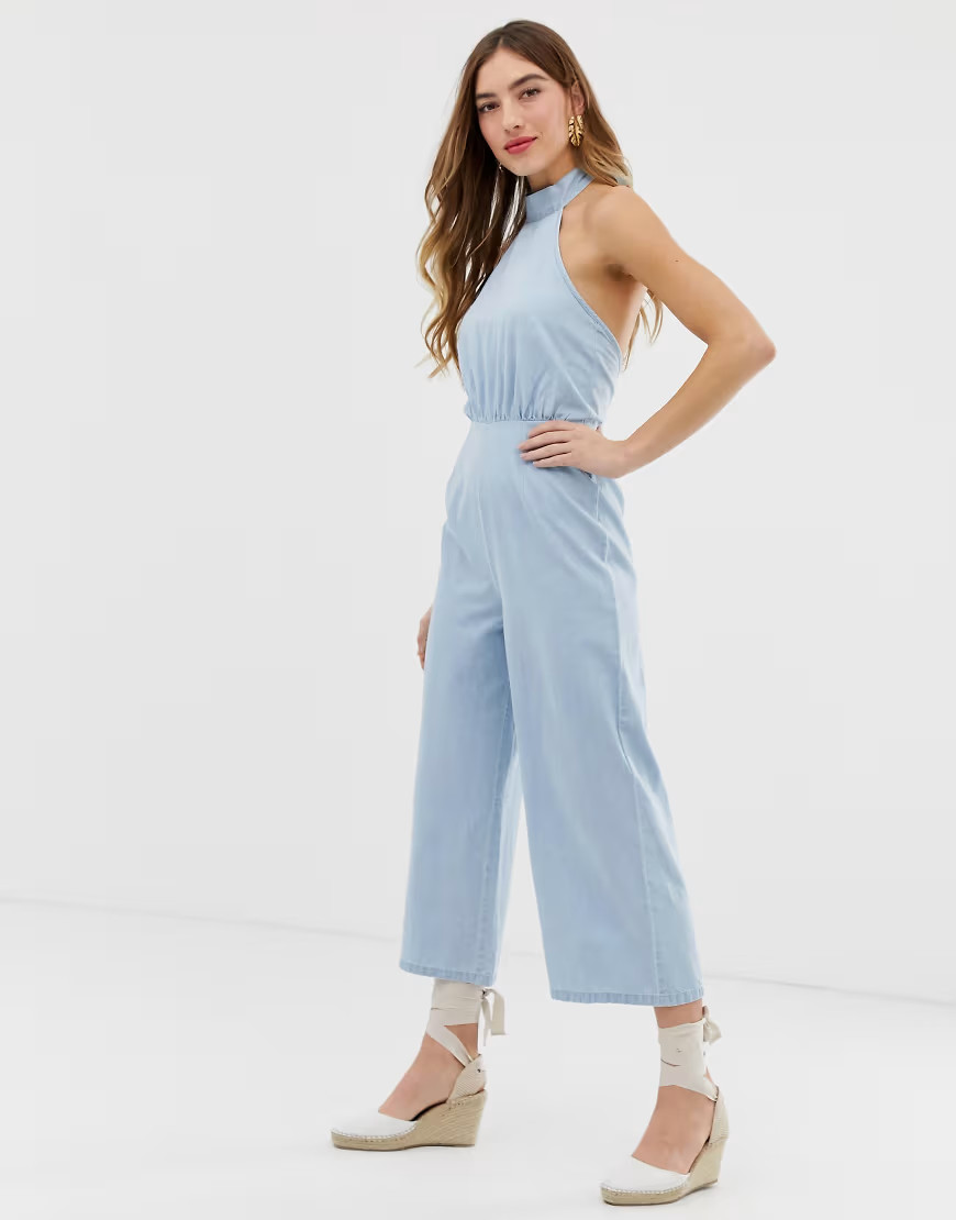 ASOS DESIGN denim halterneck jumpsuit with wide leg in lightwash blue | ASOS (Global)