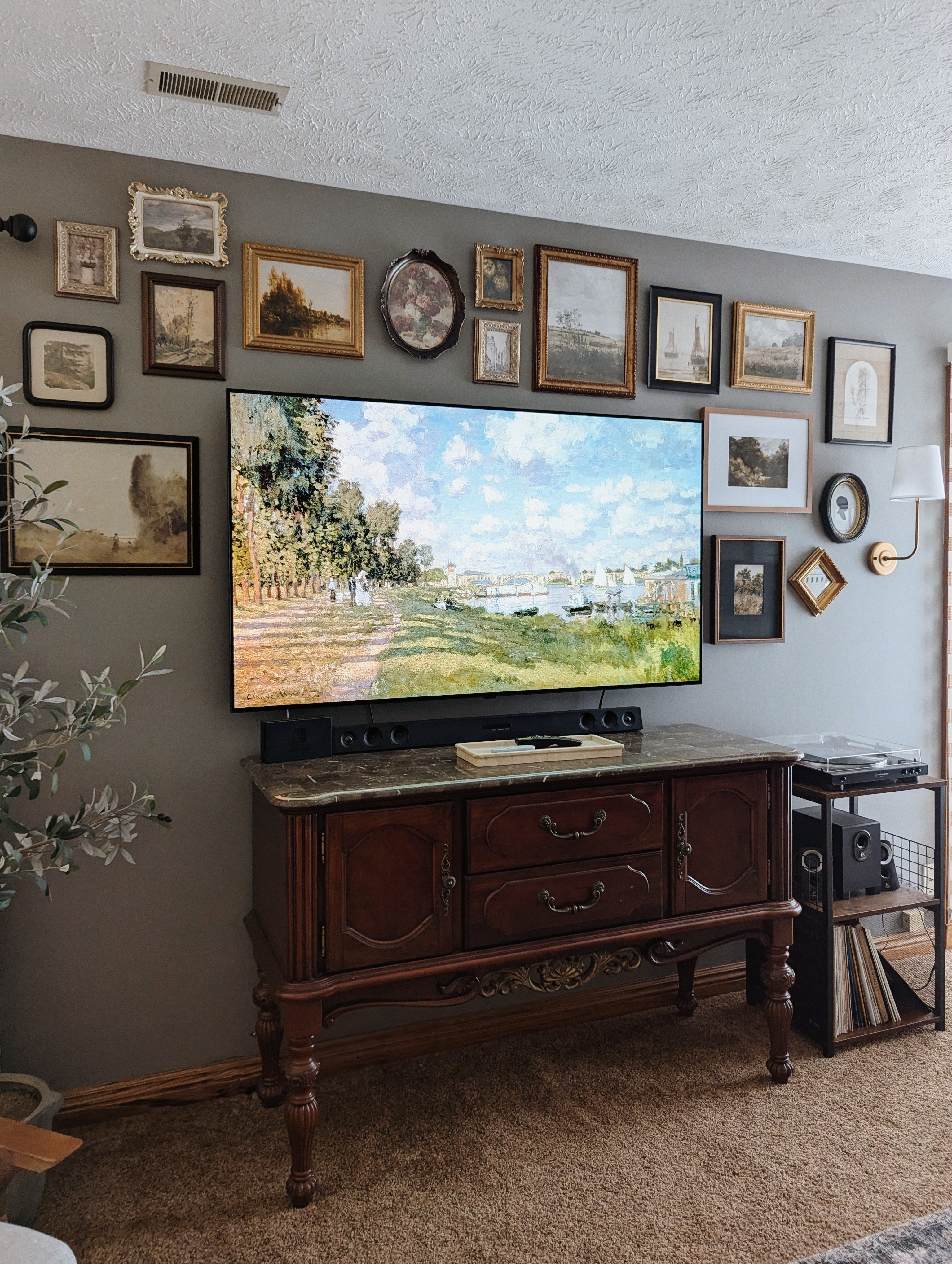 TV gallery wall art decor inspiration. I used a variety of framed vintage art in the prettiest antique frames to create a gorgeous gallery wall that makes my TV look like a piece of art! #gallerywall #vintageart #antique #vintagedecor 

#LTKHome