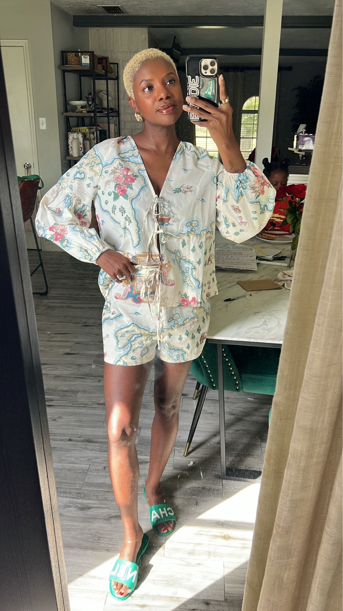 Front tie top with world map and coordinating shorts with tropical palm earring.

#LTKootd #LTKgrwm #LTKdayinmylife