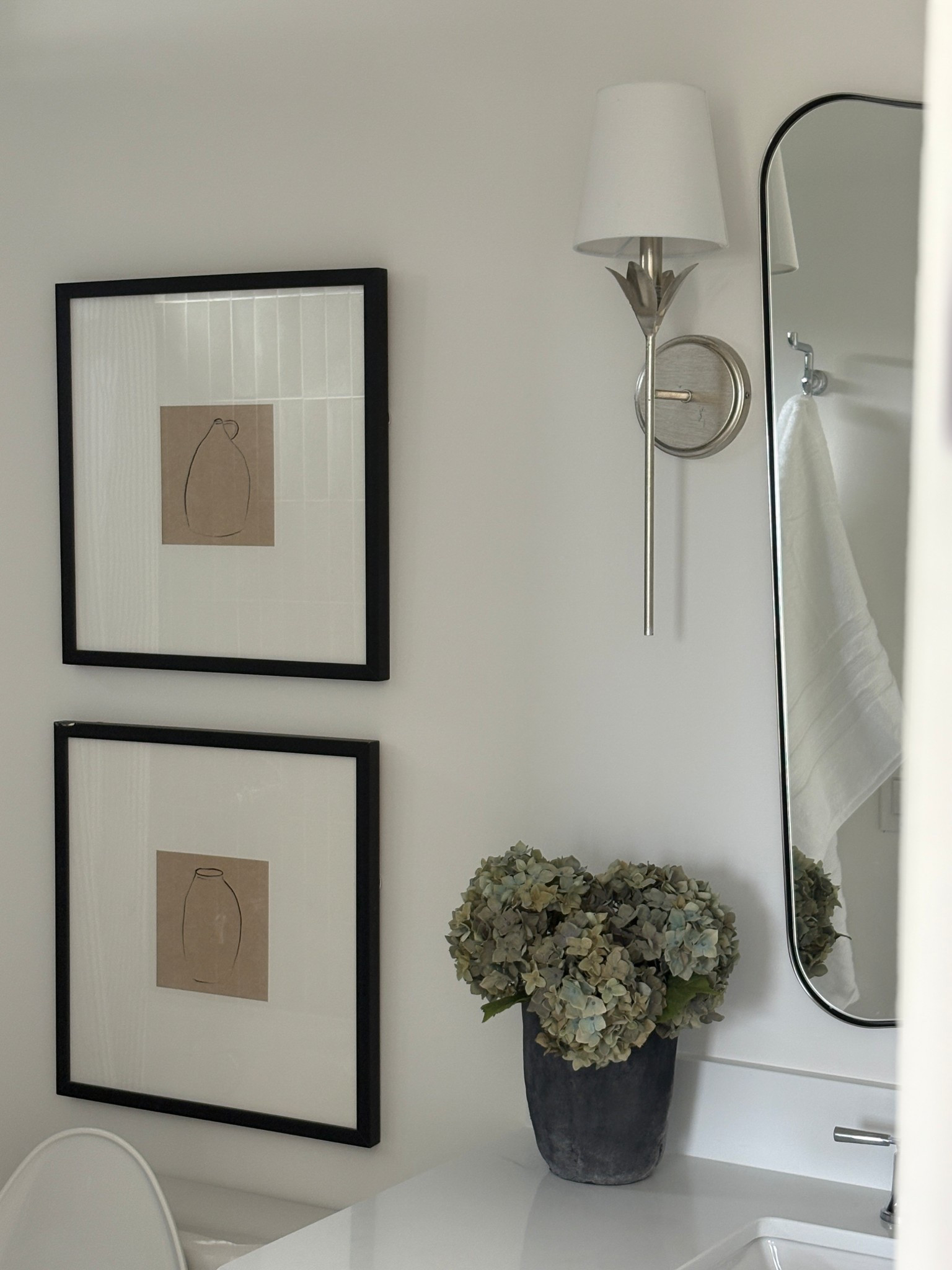 ✨ Simple + timeless bathroom details ✨ Black + white framed art, a sleek sconce, and fresh greenery make this small space feel styled but serene. Neutral finishes + clean lines are always a win 🤍

🖤 Shop my favorite bathroom lighting, wall art, mirrors & accessories to recreate this look in your home!

#BathroomDecor #NeutralHome #ModernClassic #HomeDetails #BathroomGoals #MinimalistDesign 

 

#LTKHome #LTKHome