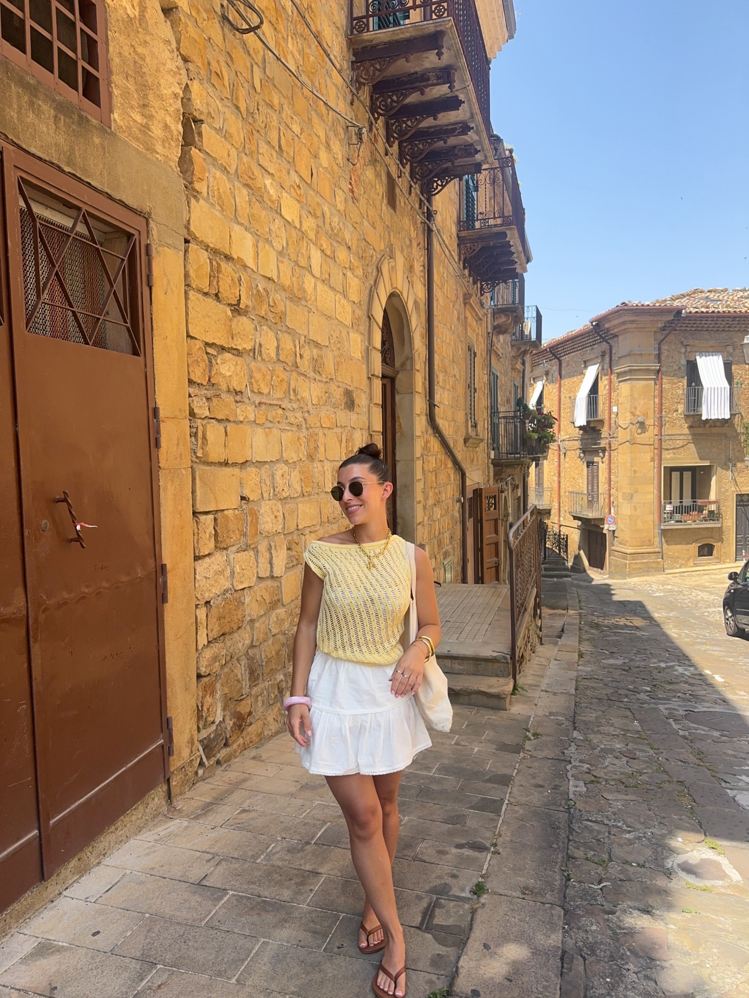 Petite outfit, butter yellow, knit top, crochet top, off the shoulder, mini skirt, ra da skirt, white floaty skirt, glowy skirt, petite style, wardrobe, essentials, summer, holiday, H&M, asos, asos design, new look, Abbott Lyon, statement jewellery, sunglasses, rayban, sandals, flip flops, tan

#LTKsummer #LTKpetite #LTKuk