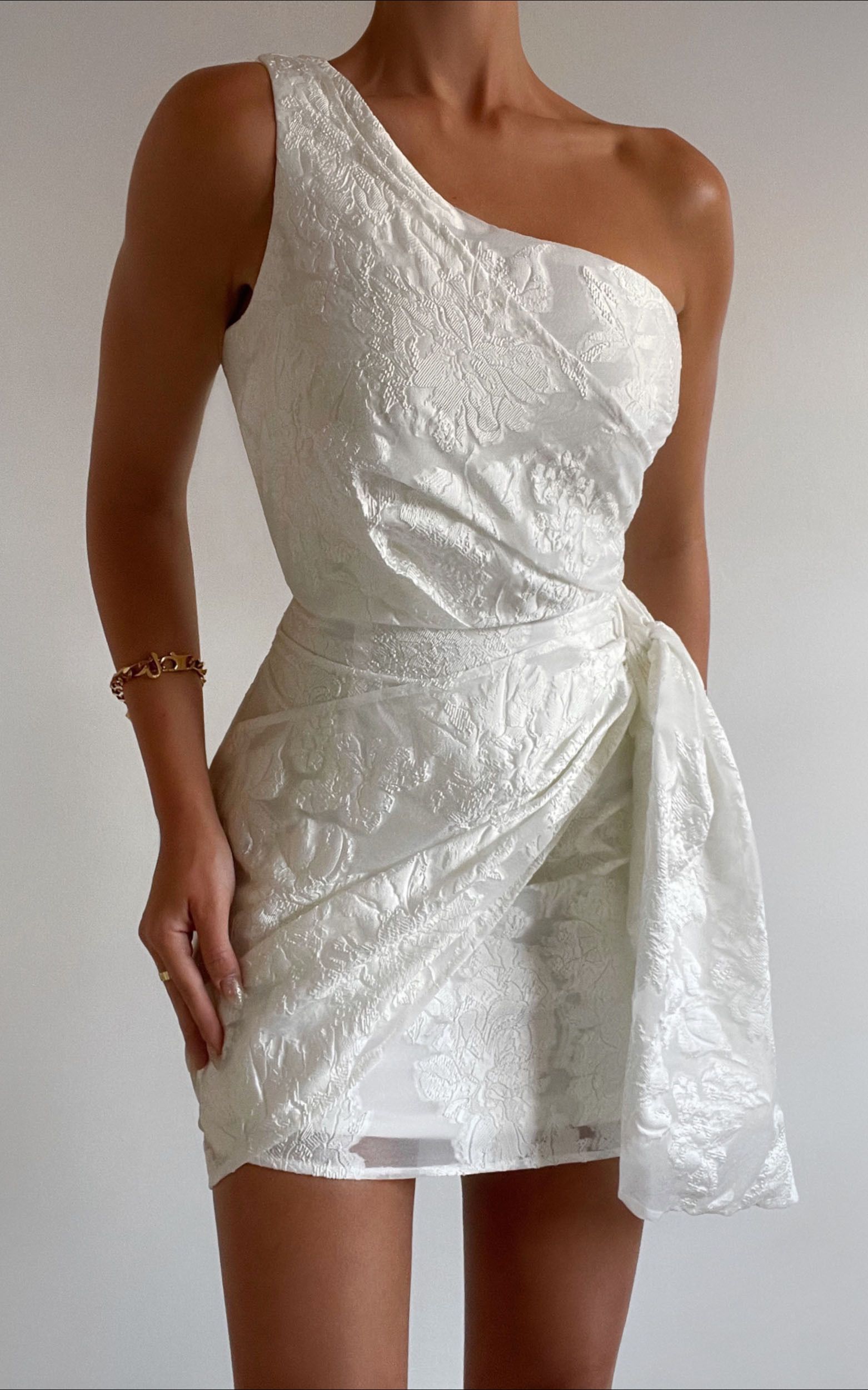 Brailey One Shoulder Wrap Front Mini Dress in White Jacquard | Showpo (US, UK & Europe)