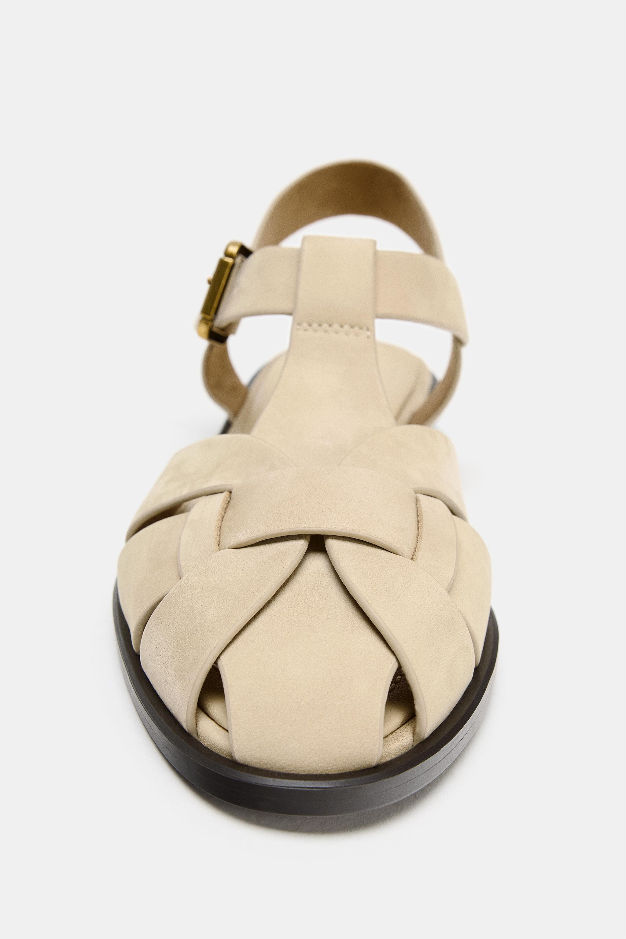 Flat leather sandals. Cage style. Metal buckle fastening at the side. Round toe.Heel height: 1 cm... | Zara UK