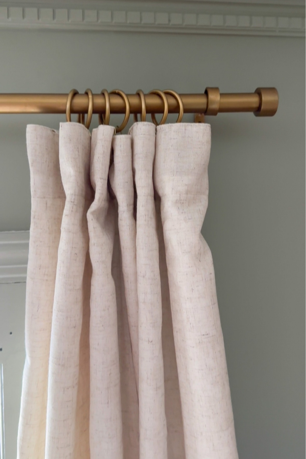 Affordable oatmeal colored neutral curtains drapes. $40 for the pair. Pewter extra long curtain rod turned antique gold with rub n buff. $9 drapery rings and drapery pins for a more designer custom look! 