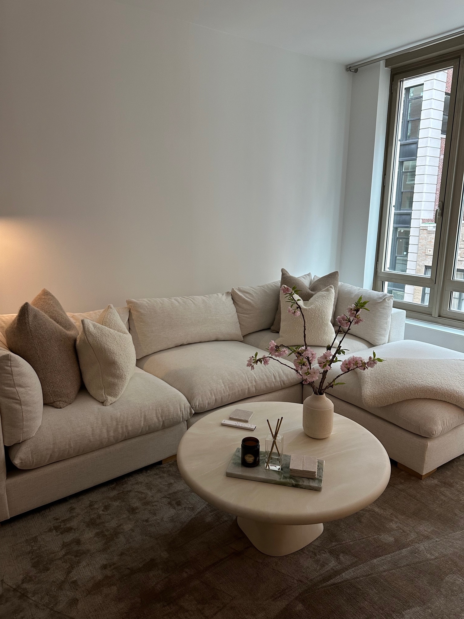 living room apartment decor — couch, coffee table, pillows, coffee table decor 

#LTKhome #LTKfindsunder100