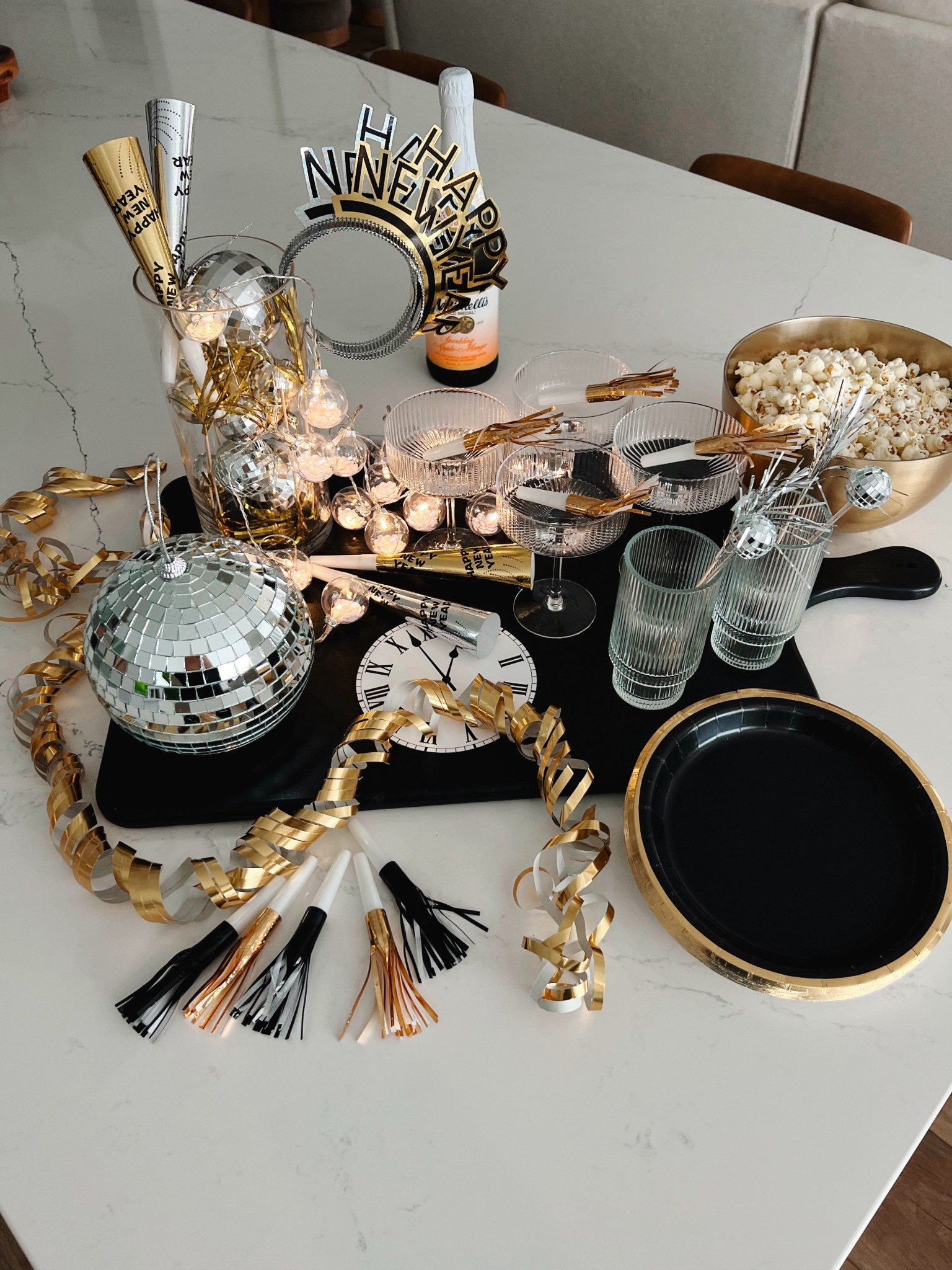 New Years Eve party counter styling! Set the party up on the kitchen island! New Years clocks, disco ball, New Year’s confetti, New Year’s party supplies