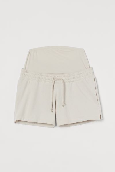 Short sweatshorts in a lightweight cotton blend. Wide panel at waist for best fit over the tummy ... | H&M (US + CA)
