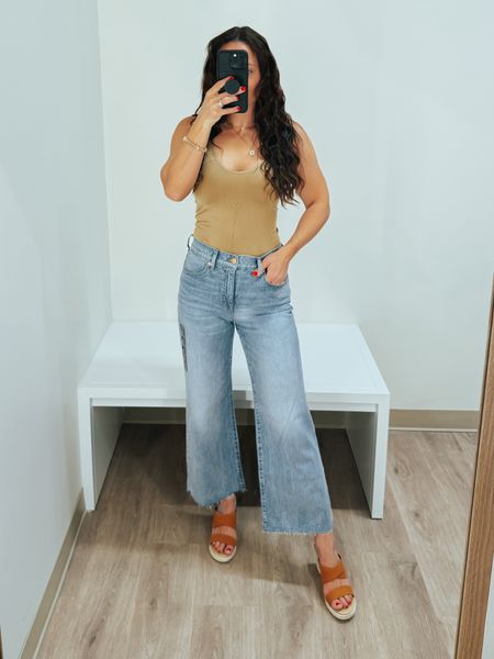 These wide leg jeans fit true to size - if in between, definitely go down. The tank is seamless and has a long length which makes it the perfect alternative to a bodysuit. Wedges fit true size! #springoutfit #denim #ltkshoecrush 

#LTKsalealert #LTKstyletip #LTKfindsunder50