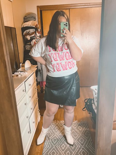 Country concert idea, wrap skirt, faux leather skort, amazon outfit, western outfit, graphic tee, western graphic tee

Shirt: Size XL (sized up)
Skirt: Size 1X plus. I sized up one size. I also tried the XXL in regular size and it was a bit snug. Fits different than the 2X plus on the listing. 

#LTKunder50 #LTKcurves #LTKFestival
