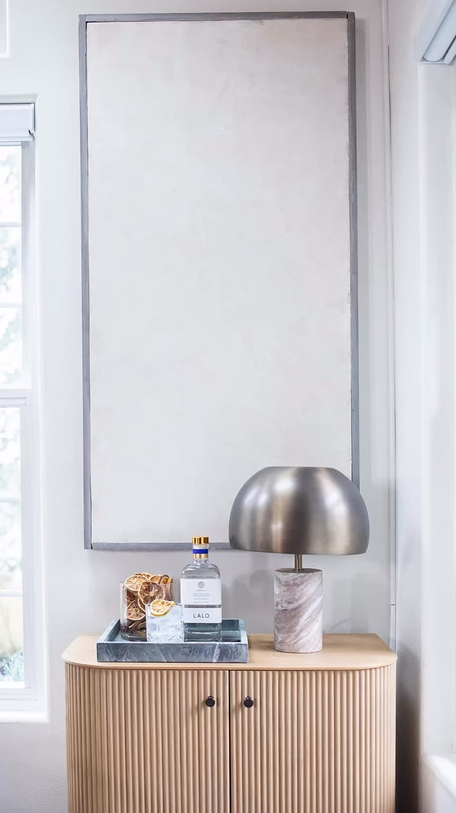West Elm cabinet + the lamp I get asked about the most 🤍

This is one of those corners that feels elevated without trying too hard. The cabinet has the prettiest texture and warm wood tone, and that lamp adds just the right amount of contrast with its stone base and metal shade.

If you’re going for that clean, high-end, lived-in look… these two do all the work.

Linked both here 

#LTKHome