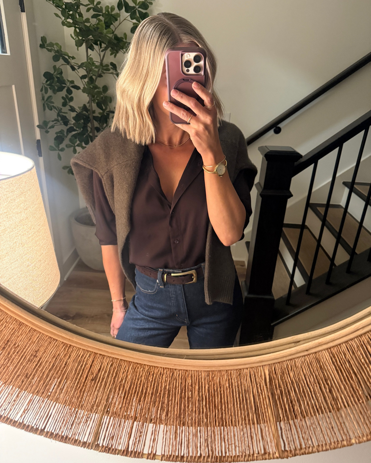 Wearing medium silk blouse (sized up one), small sweater, 26/reg jeans, heels tts