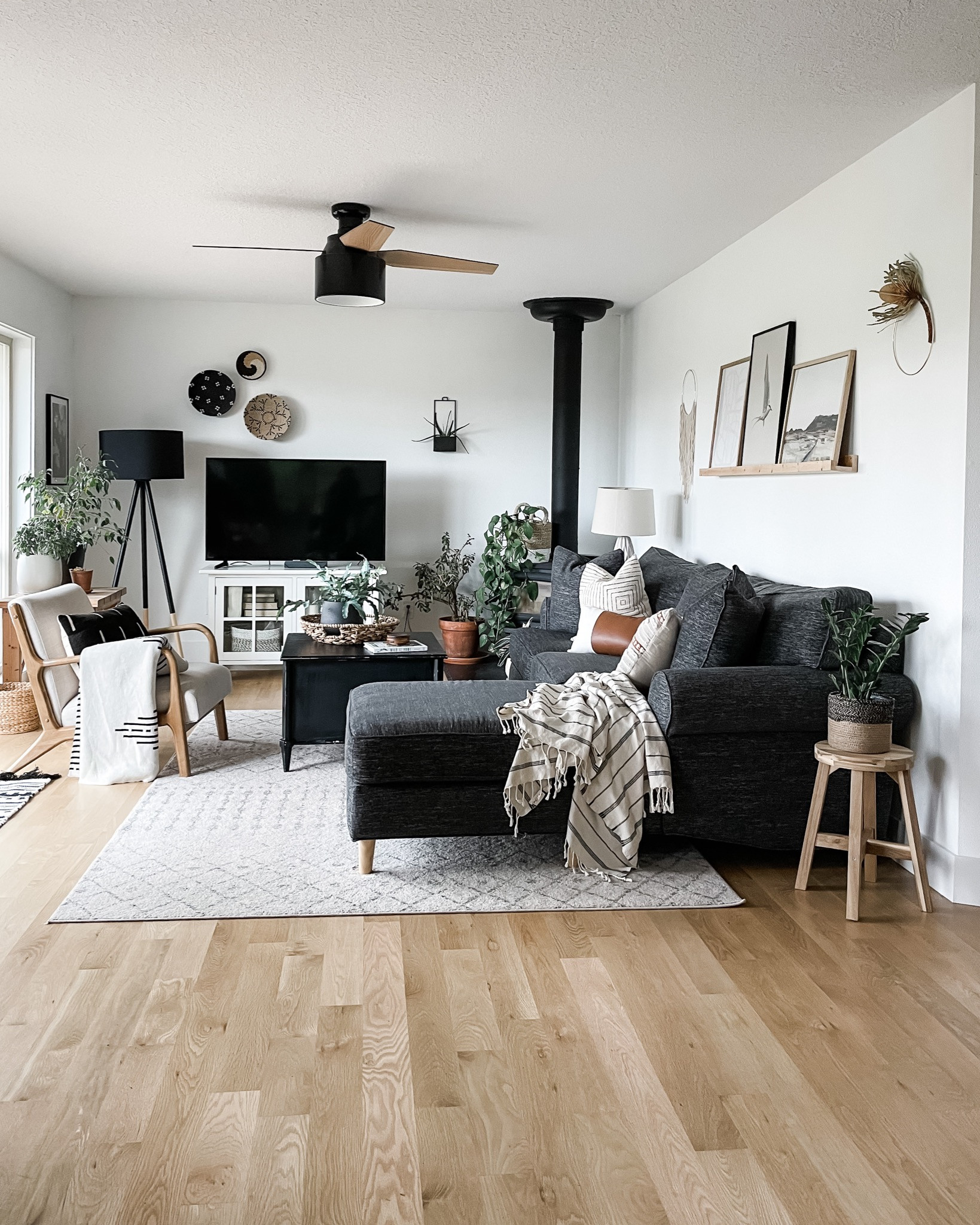 TEXTURE TIP : Use different types of texture for depth and interest. In this living room, I included texture with baskets, wood shelves, blankets, terra cotta pots, pillows, and dried botanicals.  Makes it feel cozy & authentic!  

More: https://www.allisajacobs.com/7-ways-to-add-texture-to-home-decor/ 

 #LTKHome
