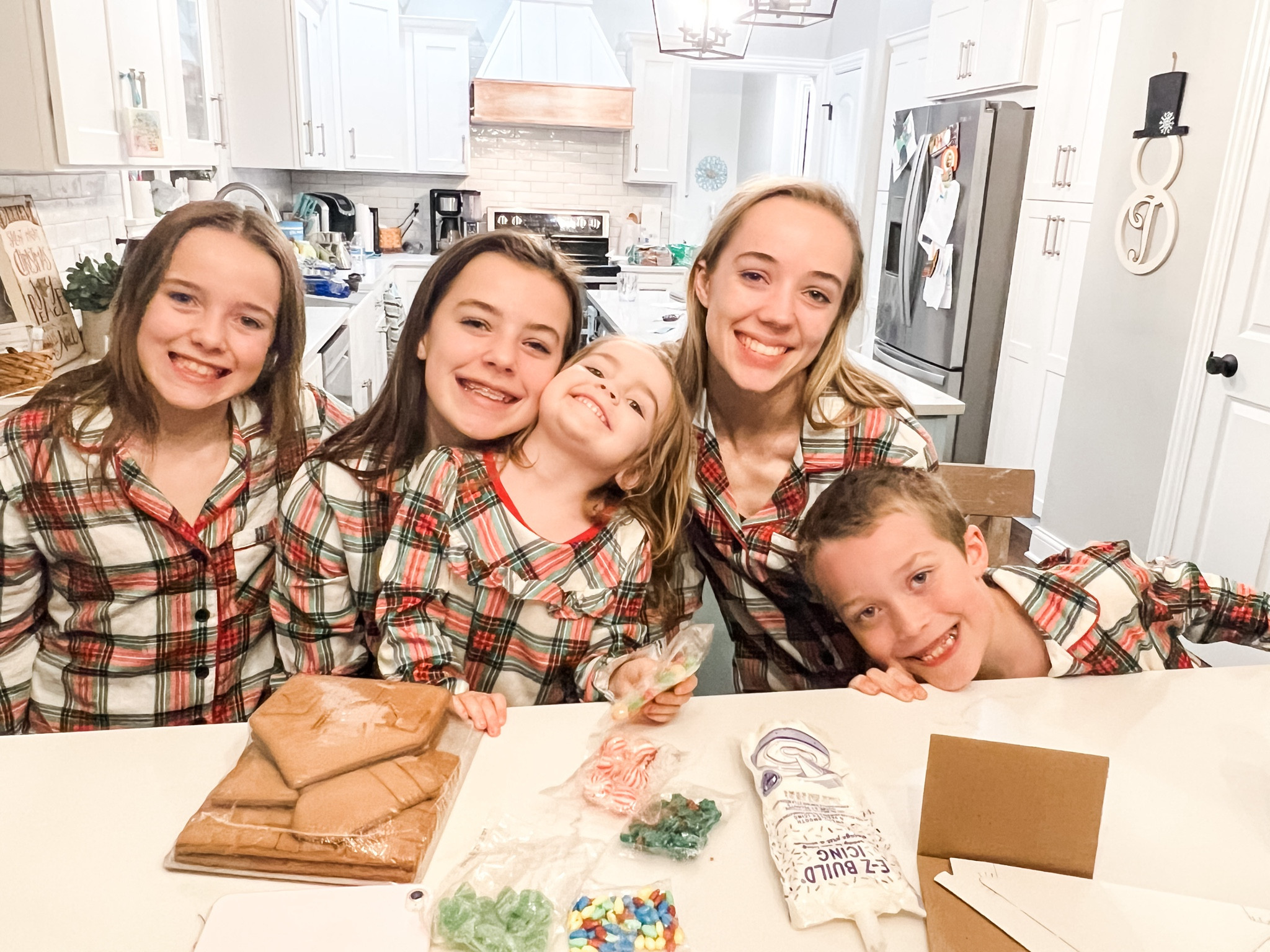 It was matching pajamas and gingerbread house night! Note to self: next time, each kid gets their own house to decorate! 😬 But don't they look so cute in the picture?! 😂

#LTKGiftGuide #LTKHoliday #LTKkids