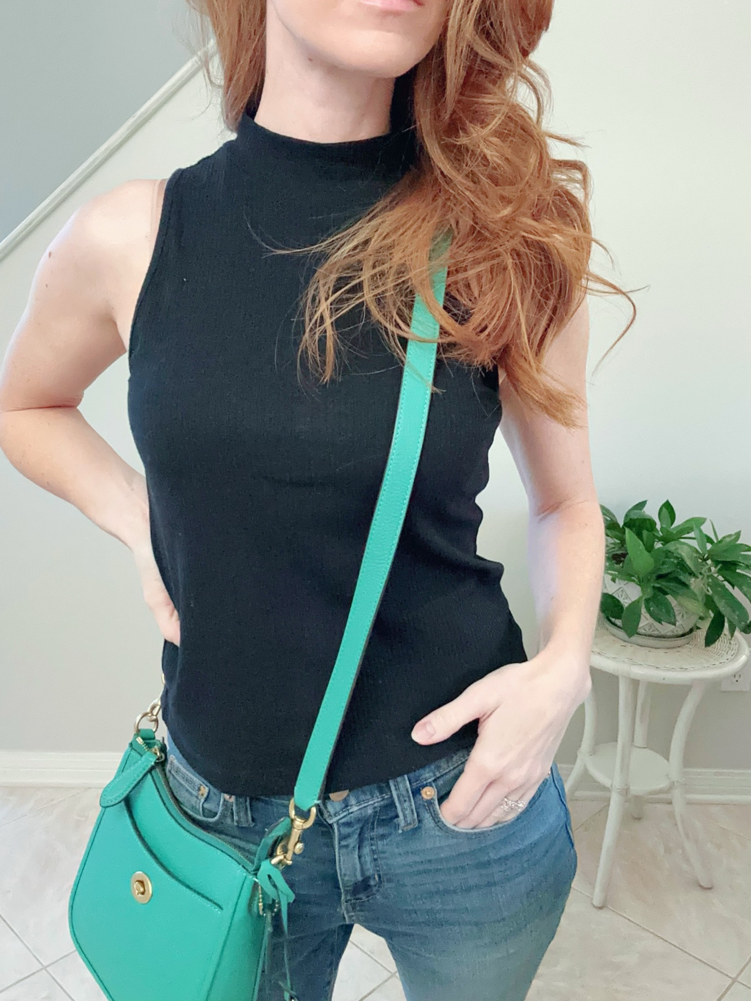 Black mock-neck shell from LOFT and black flats from J. Crew Factory. Pop of green for the purse  

#LTKstyletip