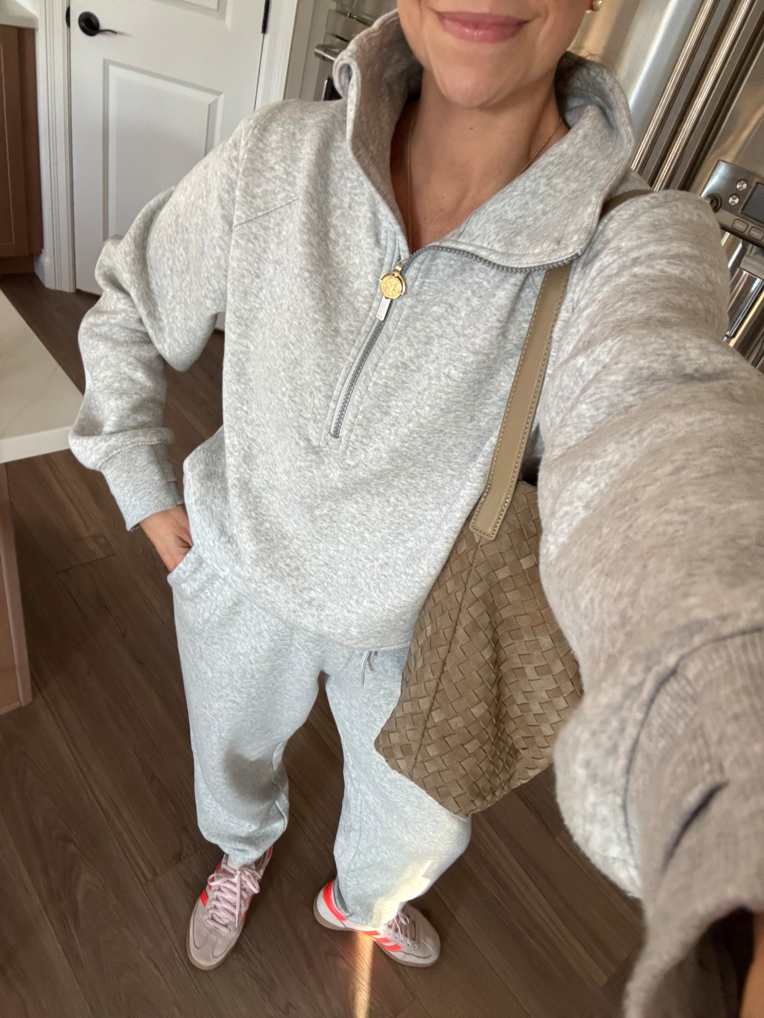 My favorite lounge set half zip and sweatpants are so comfortable and the prettiest gray color. I’m wearing extra small pants and small top.